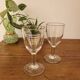 2 small stemmed glasses