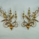 Pair of large floral wall lamps in gilded and lacquered metal. Italy 1960s