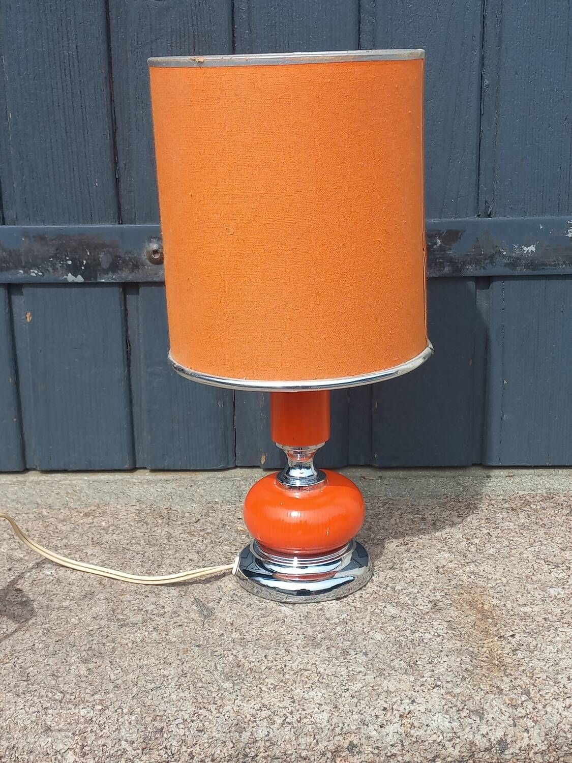 Designer lamp from the 70s in chrome metal and orange lacquered wood