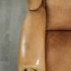 Comfortable cowhide wingback armchair with a timeless English look