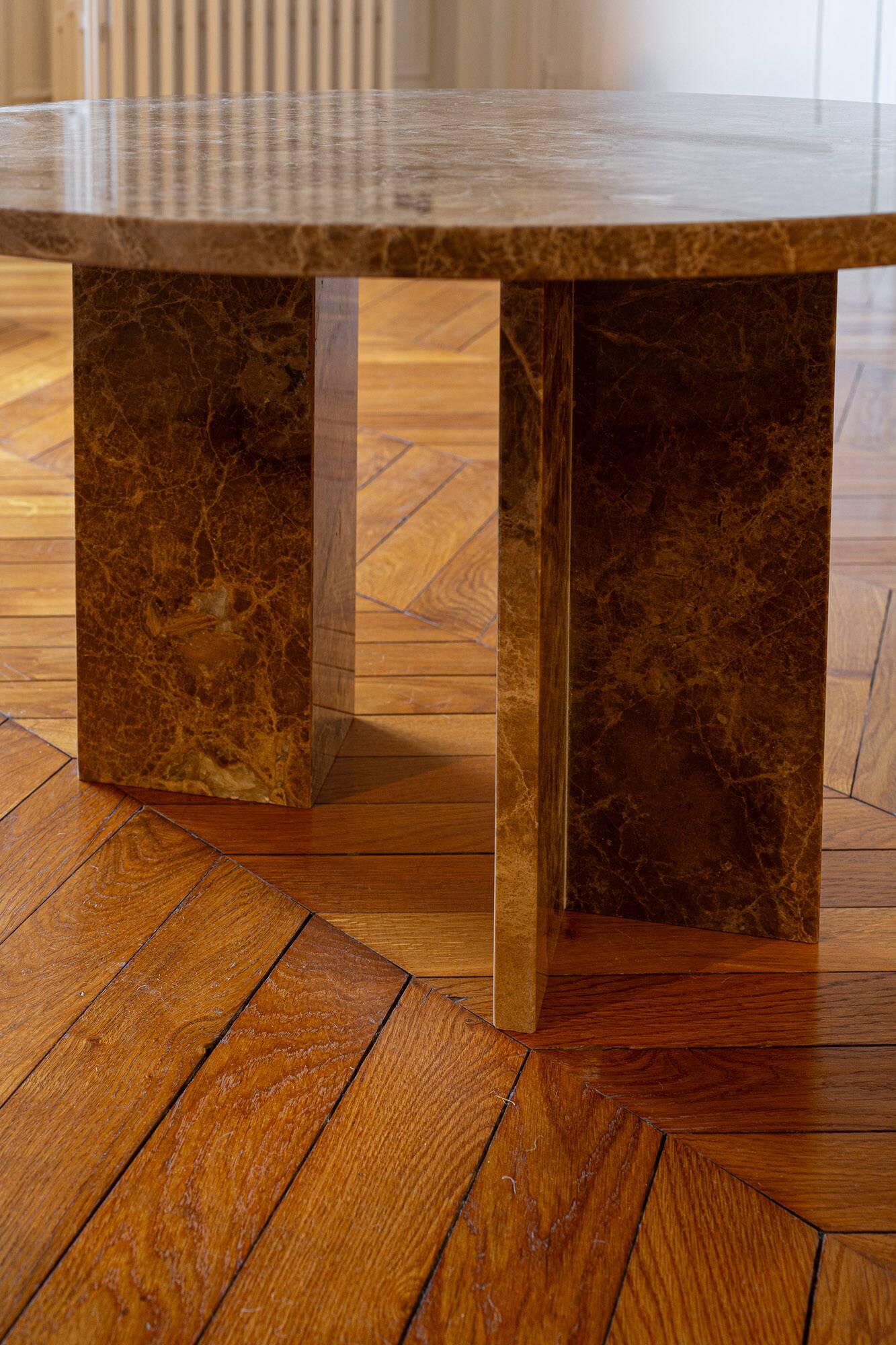 Round table in beige marble