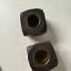 Pair of 1960s teak and brass "dice" candlesticks