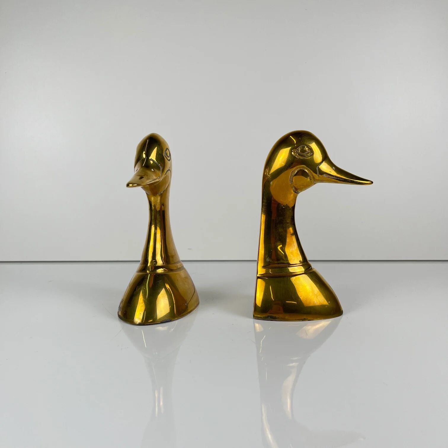Pair of brass bookends in the shape of a duck's head, 1970.