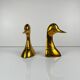Pair of brass bookends in the shape of a duck's head, 1970.