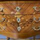 Pair of Louis XV style bedside tables in rosewood marquetry.