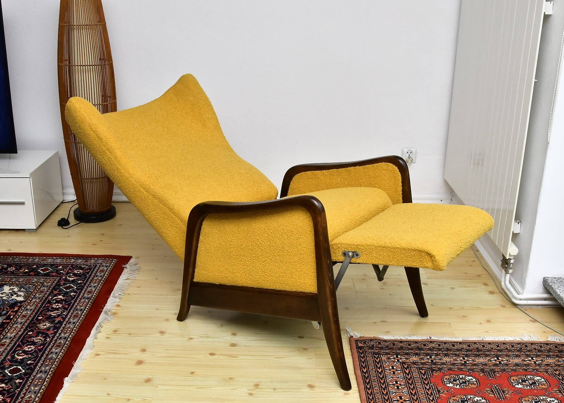 Yellow boucle wingback chair with folding footstool, 1950s