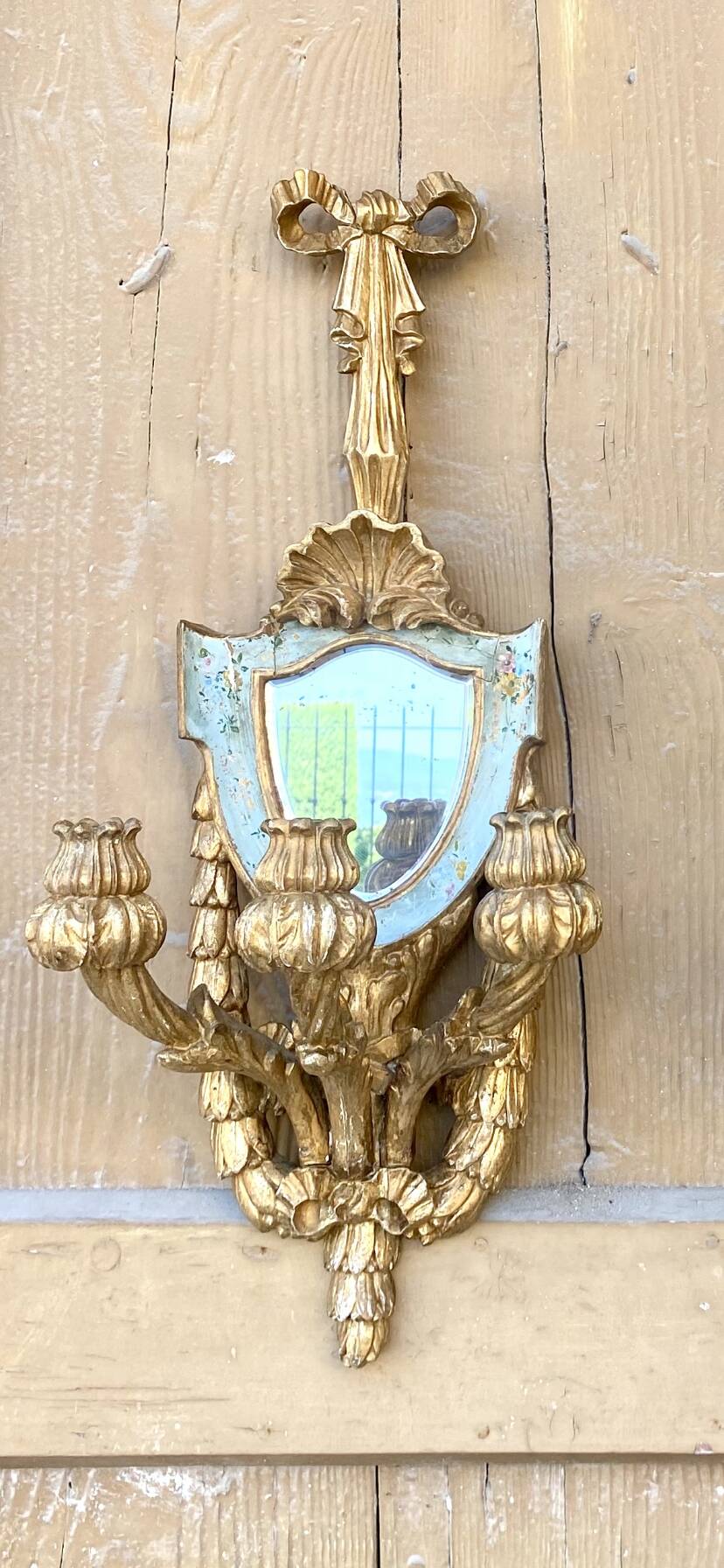 Pair of carved wood sconces