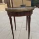 Gray marble mahogany pedestal table and brass gallery