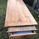Antique farmhouse table in solid cherry wood with 2 drawers and 1 pull-out at the end with turned legs.
