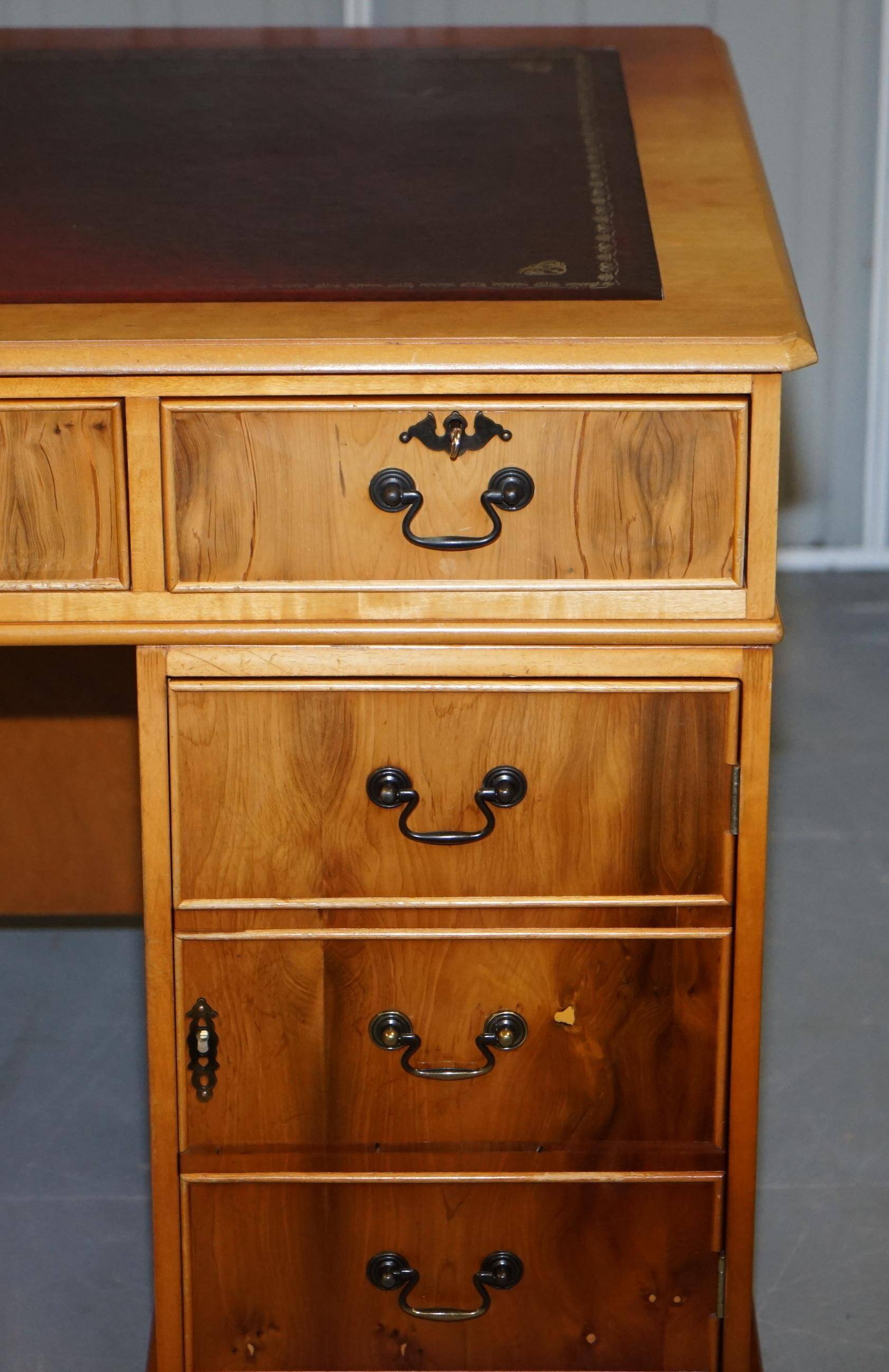 Vintage satin wood partner desk with leather top.