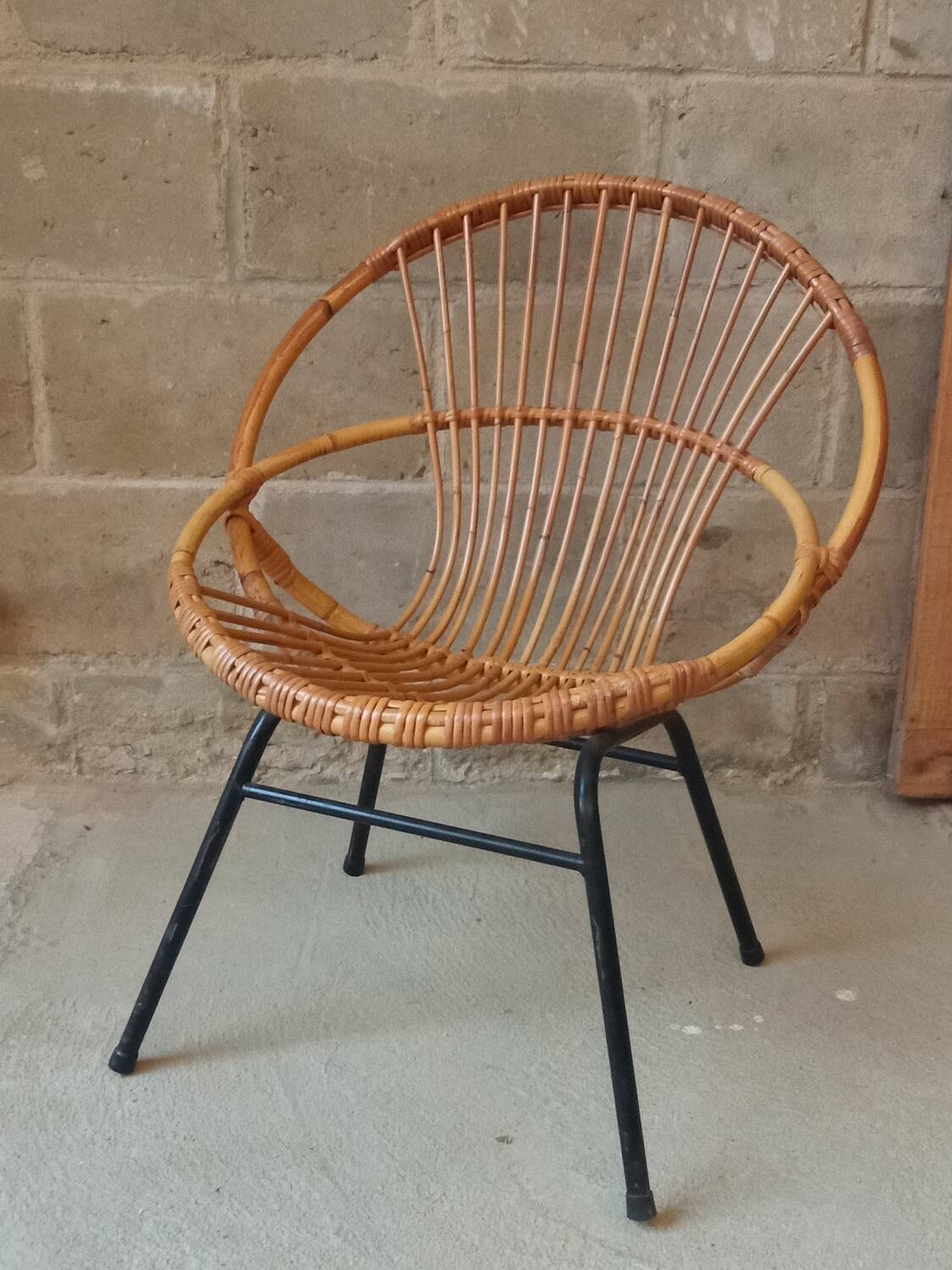 Rattan armchair with metal base from the 1950s