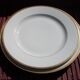 2 plats ronds porcelaine de Limoges bordure dorée