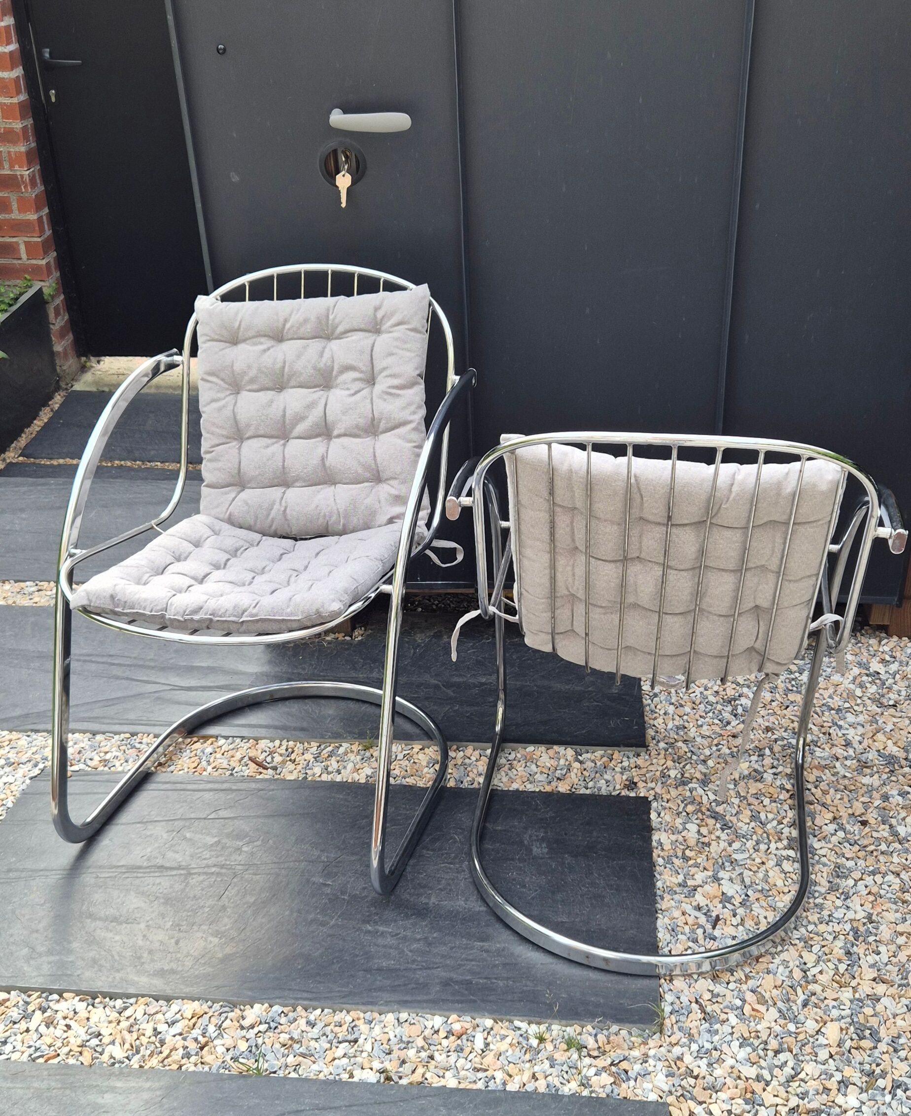 A pair of space age wire chairs