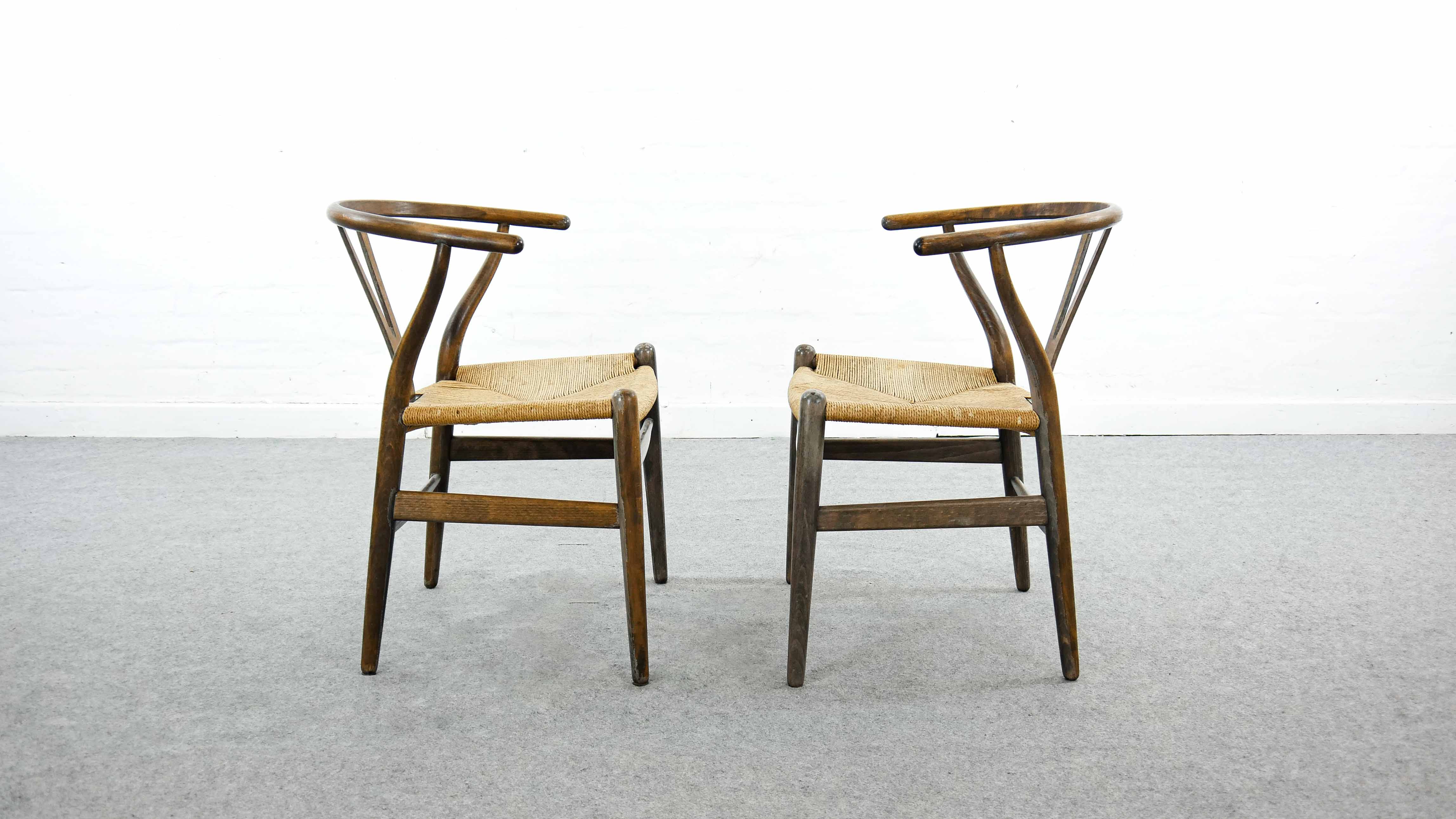 Pair of CH24 wishbone dining chairs by Hans Wegner for Carl Hansen Denmark