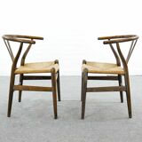 Pair of CH24 wishbone dining chairs by Hans Wegner for Carl Hansen Denmark