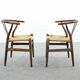 Pair of CH24 wishbone dining chairs by Hans Wegner for Carl Hansen Denmark