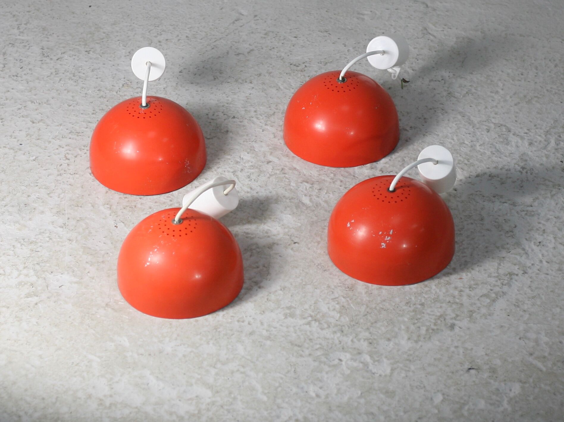 Set of 4 "spring" hanging lamps, orange steel, France, circa 1970