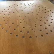 Pair of vintage wooden folding chairs with star pattern on seat