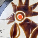 Round ceramic coffee table with “rooster” motif by Dan