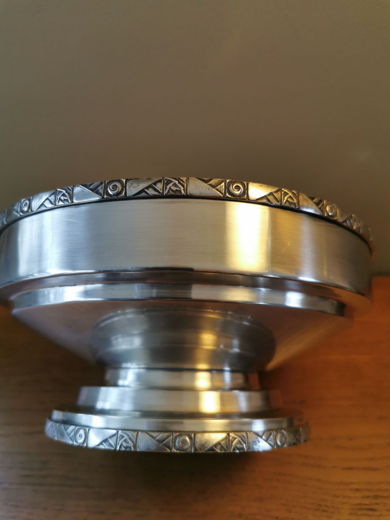 Art Deco coupe on a silver-plated metal stand.