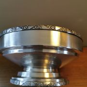 Art Deco coupe on a silver-plated metal stand.