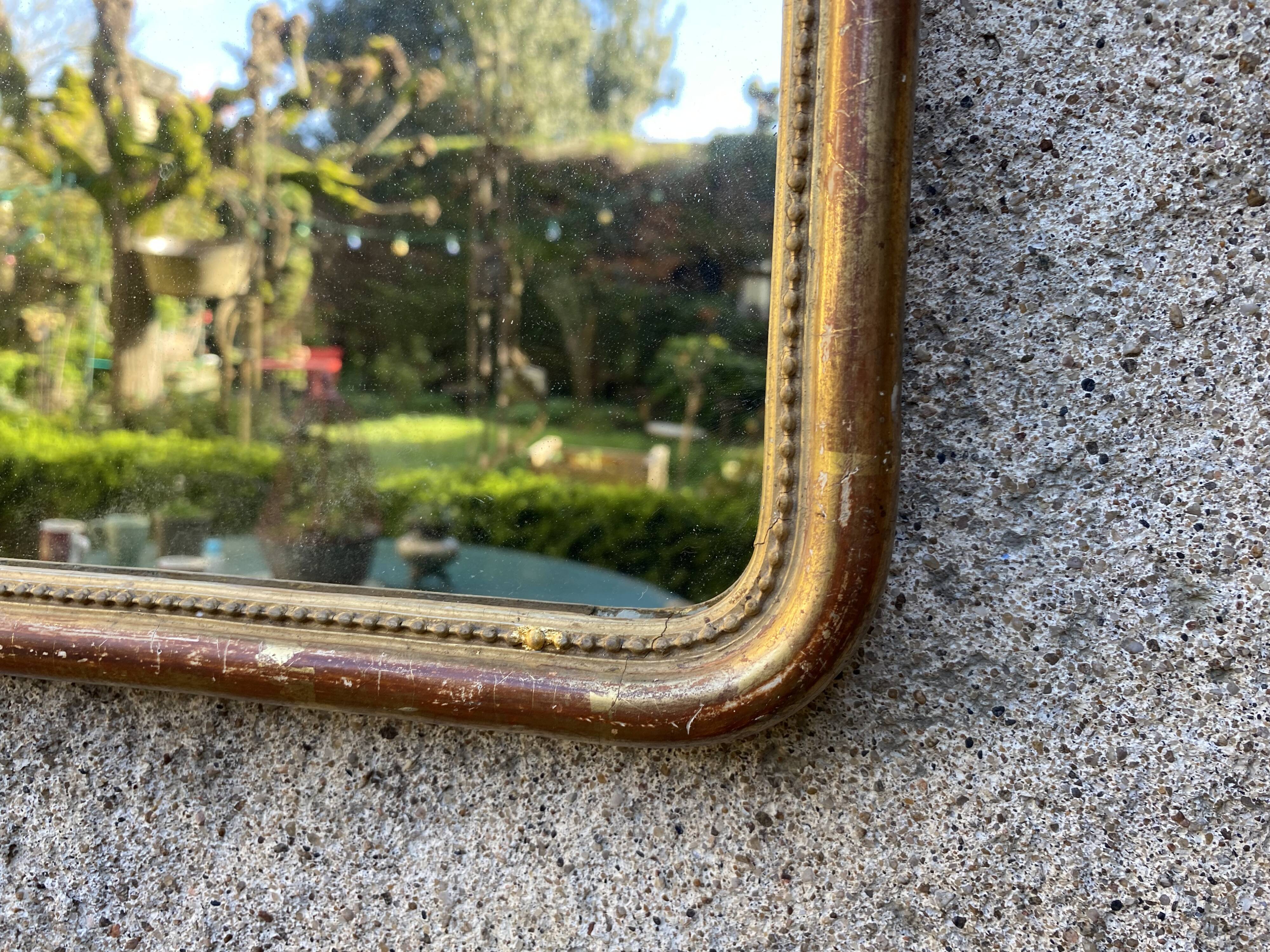Louis-Philippe mirror gilded with gold leaf