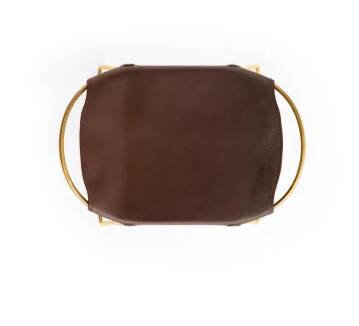 Contemporary kitchen stool in aged brass and dark brown leather.