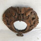 Ancient mirror in carved wood, vintage decoration