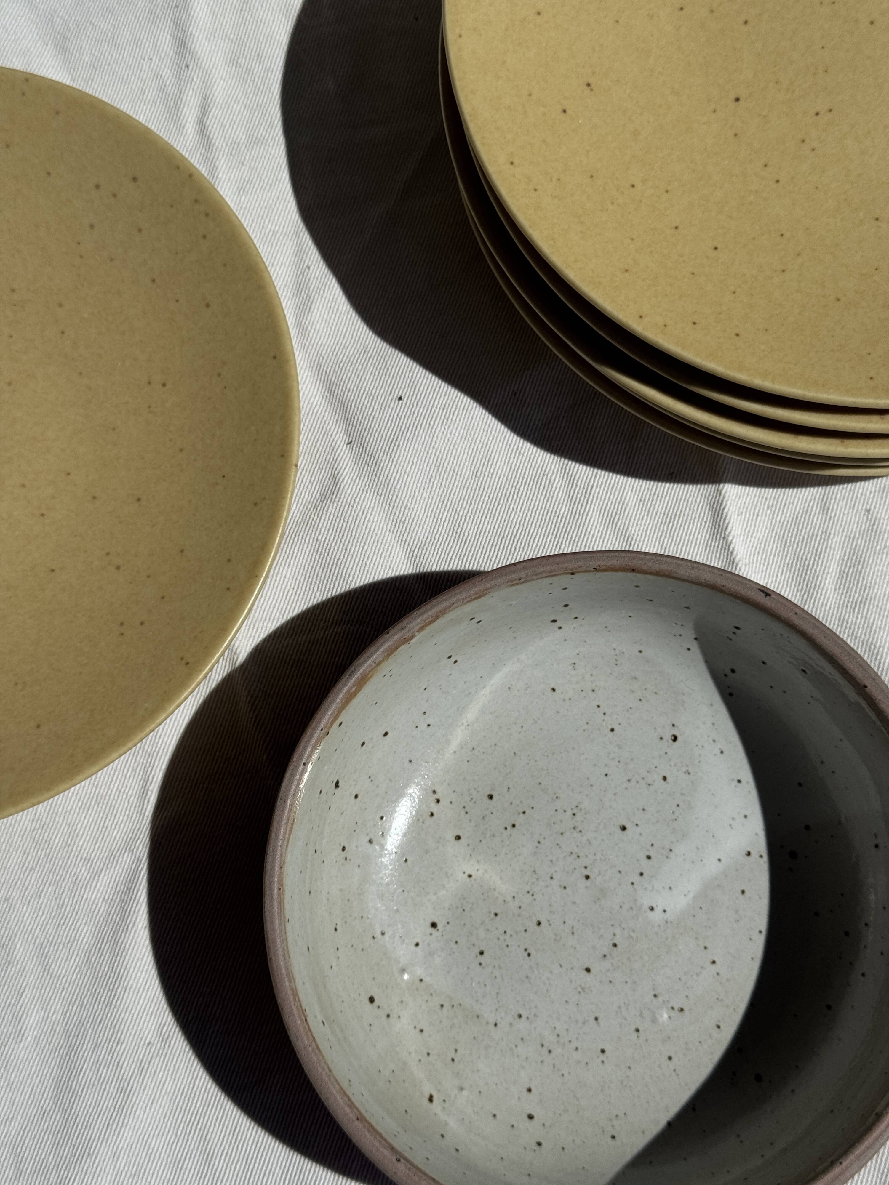 A speckled grey interior bowl with a matte brown exterior H5 D15