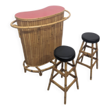 Vintage sixties tiki bar with stools.