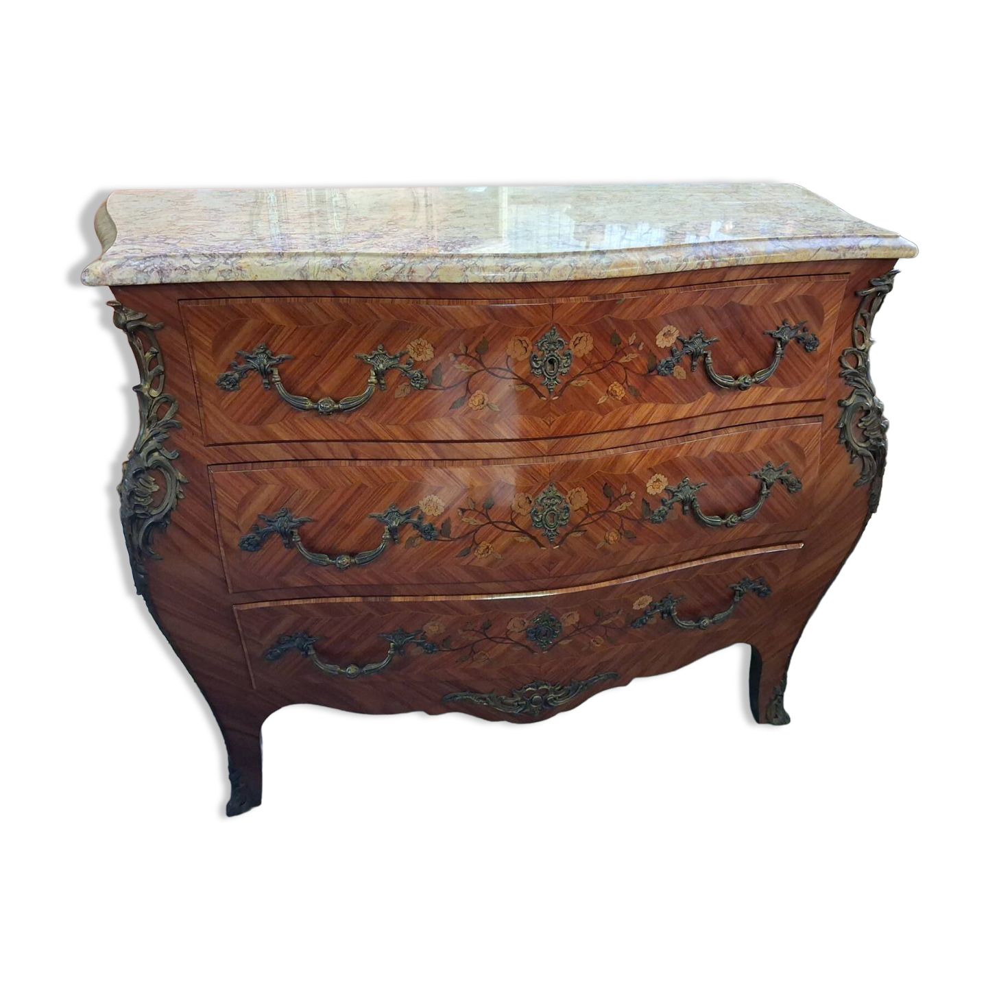 Curved Louis XV style commode with marquetry, opening with three drawers.