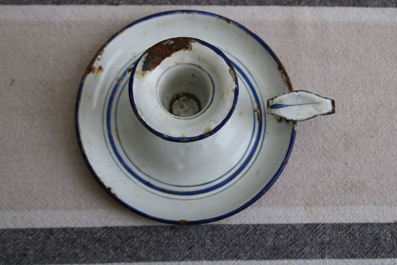 Old enamel candle holder