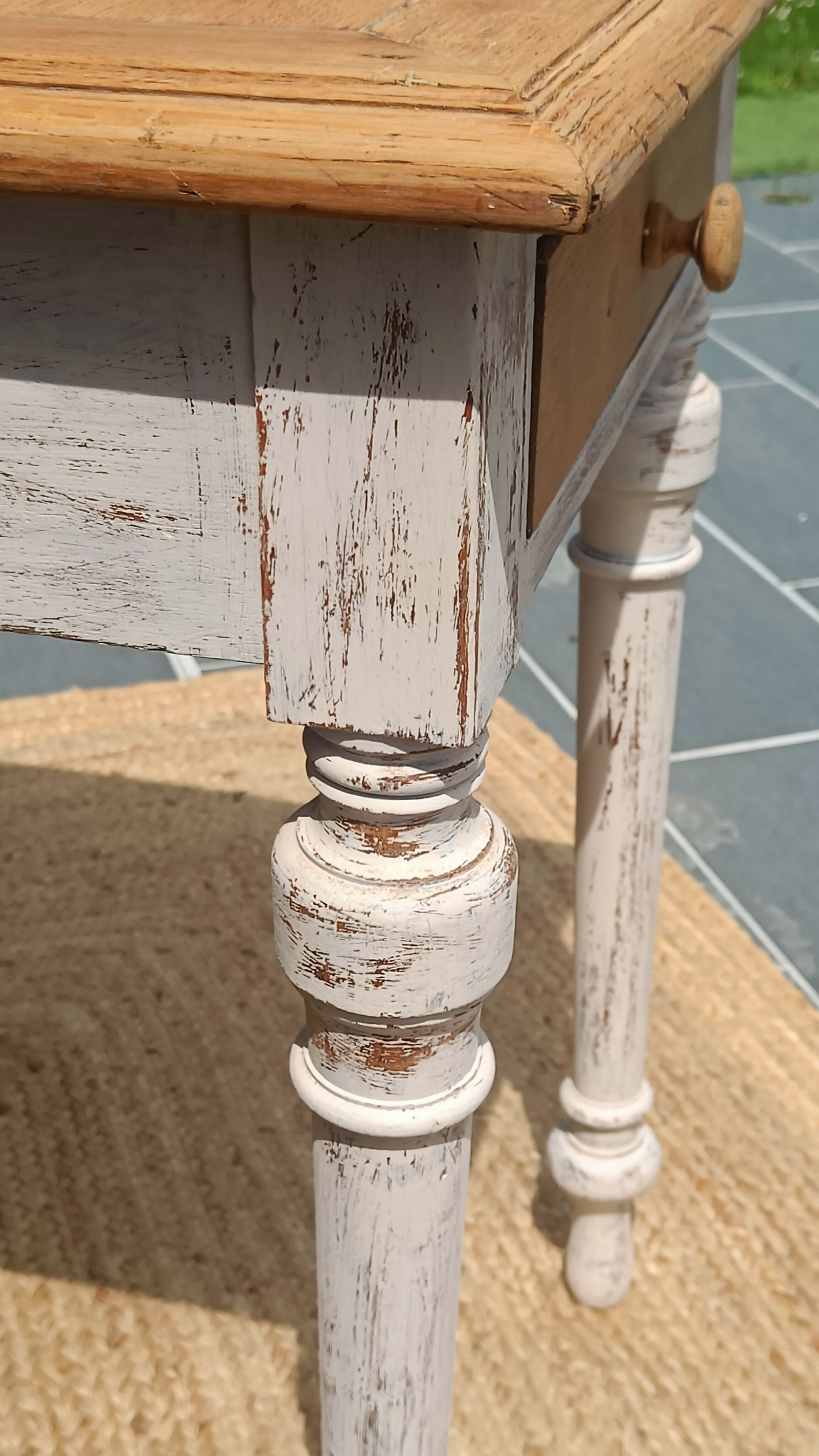 Antique drawer table with a patina.