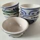 7 stoneware bowls with blue and green ocean-inspired decoration