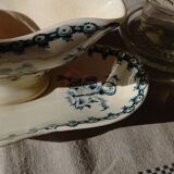 Old gravy boat on frame in terre de fer earthenware by gien, “chardons” model in blue-green