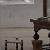 Vintage African artisanal stool, triangular shape with 3 legs, cowhide, 20th century.