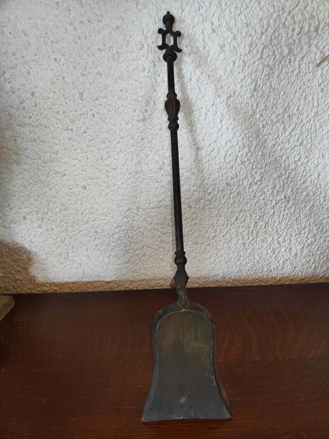 Cast iron carved fireplace shovel