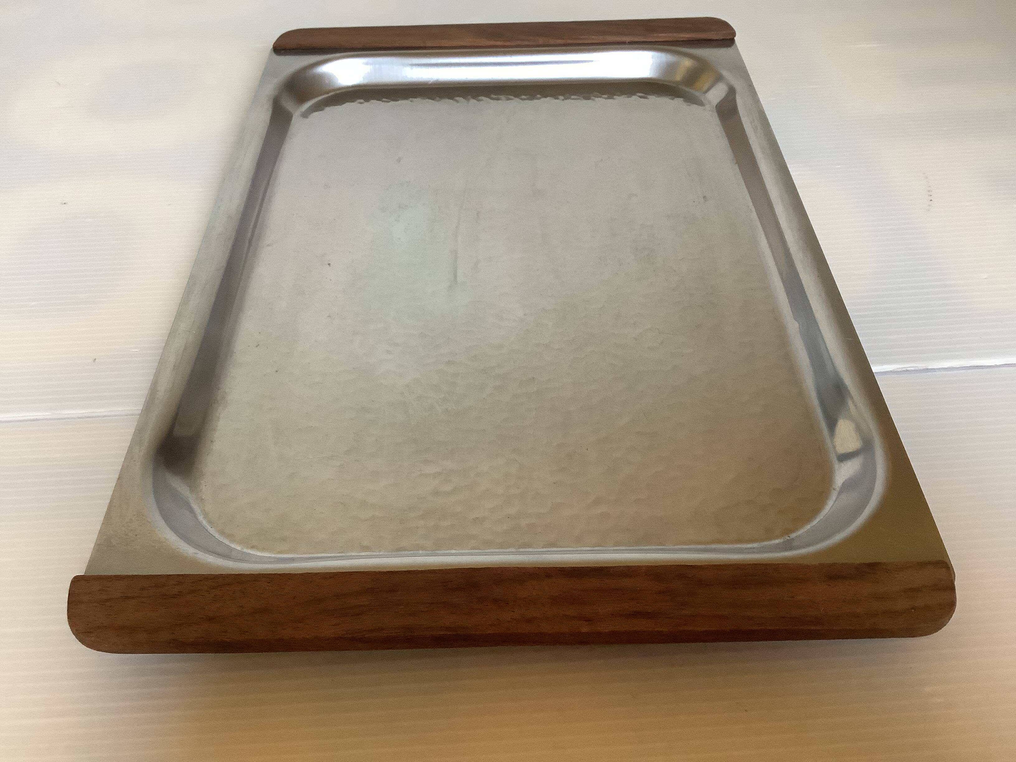 Small hammered metal and wood tray in Scandinavian style.