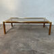 Gold metal coffee table with elm burl imitation.