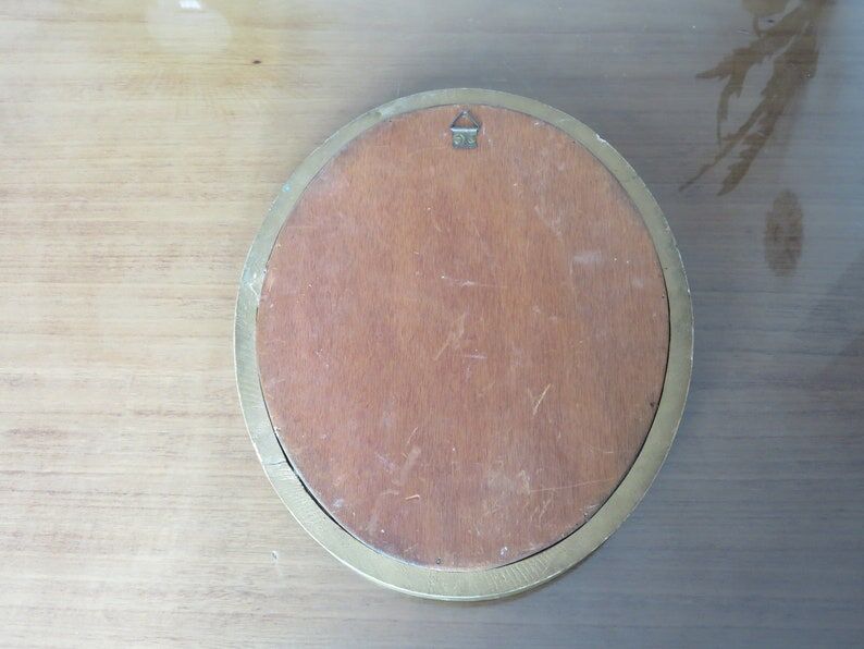 Old oval mirror in gilded wood 50s 60s