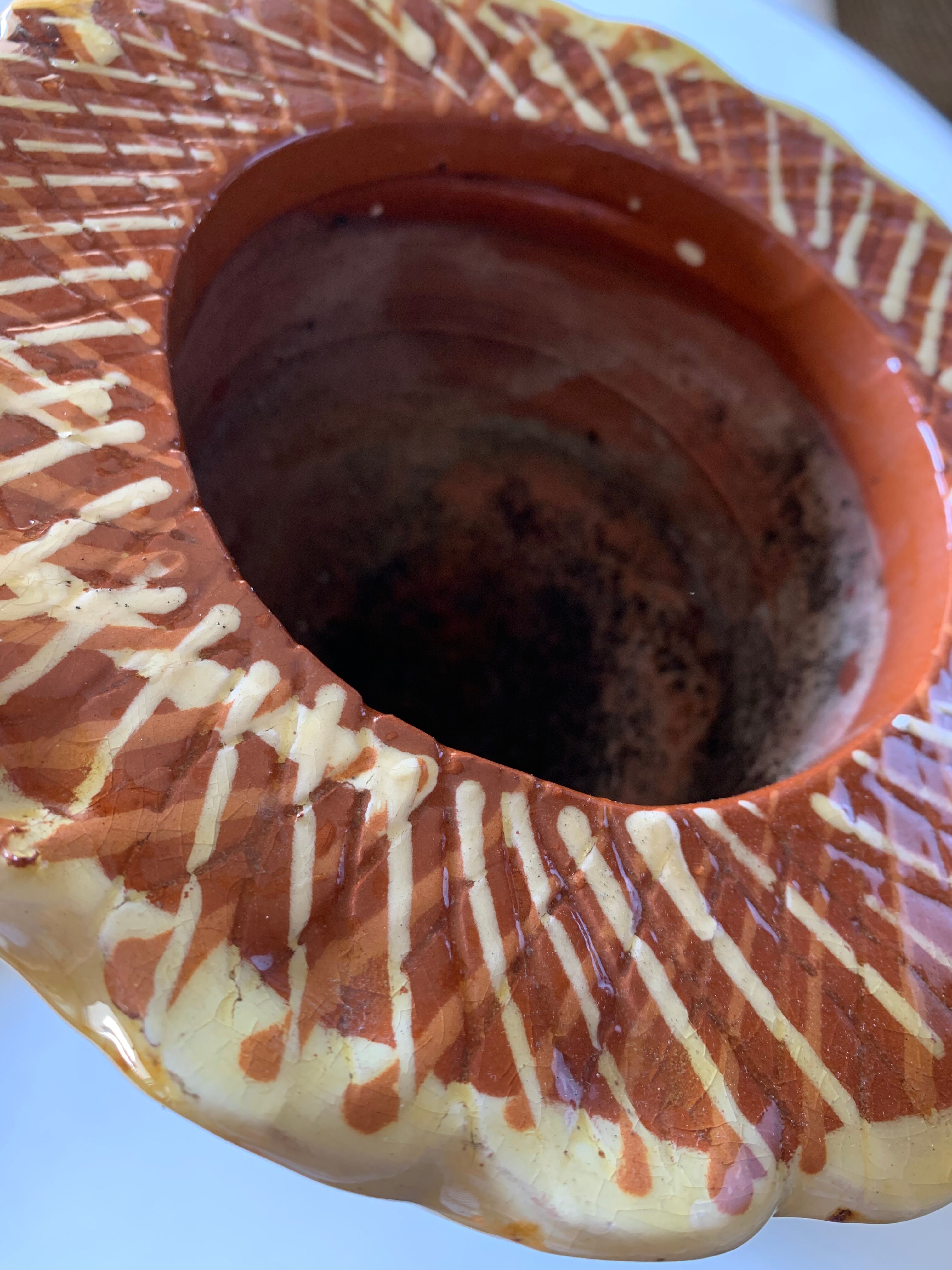 Terracotta plant holder head shape