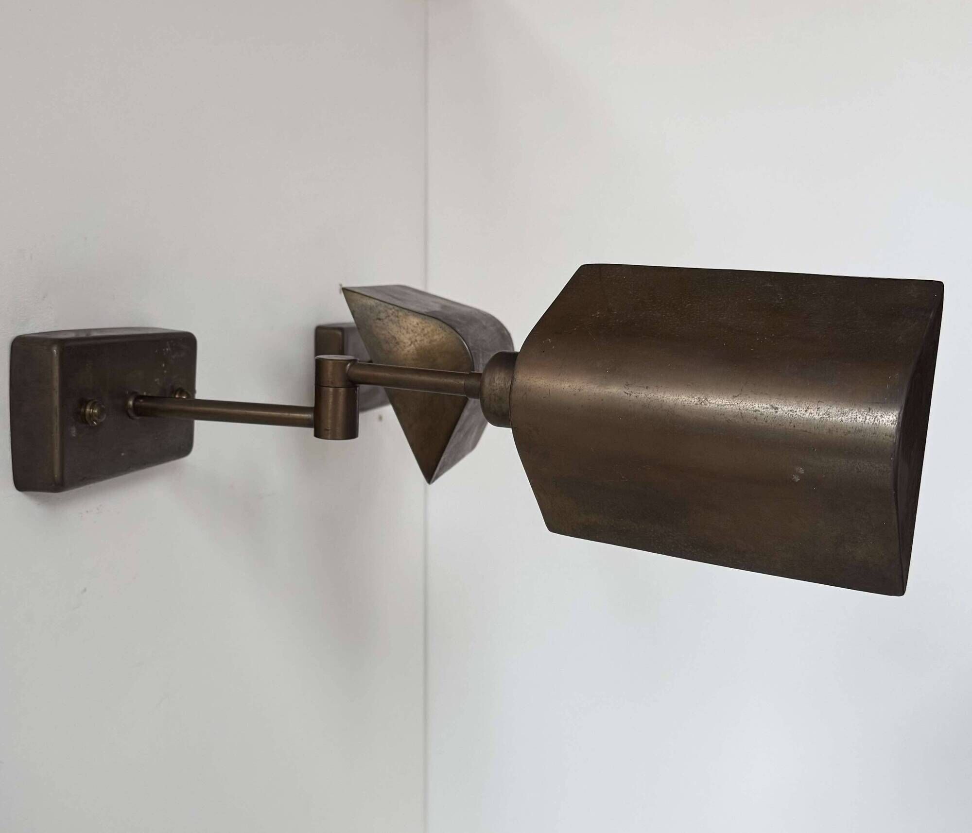 Pair of vintage adjustable wall lights, patinated brass, France 1970.