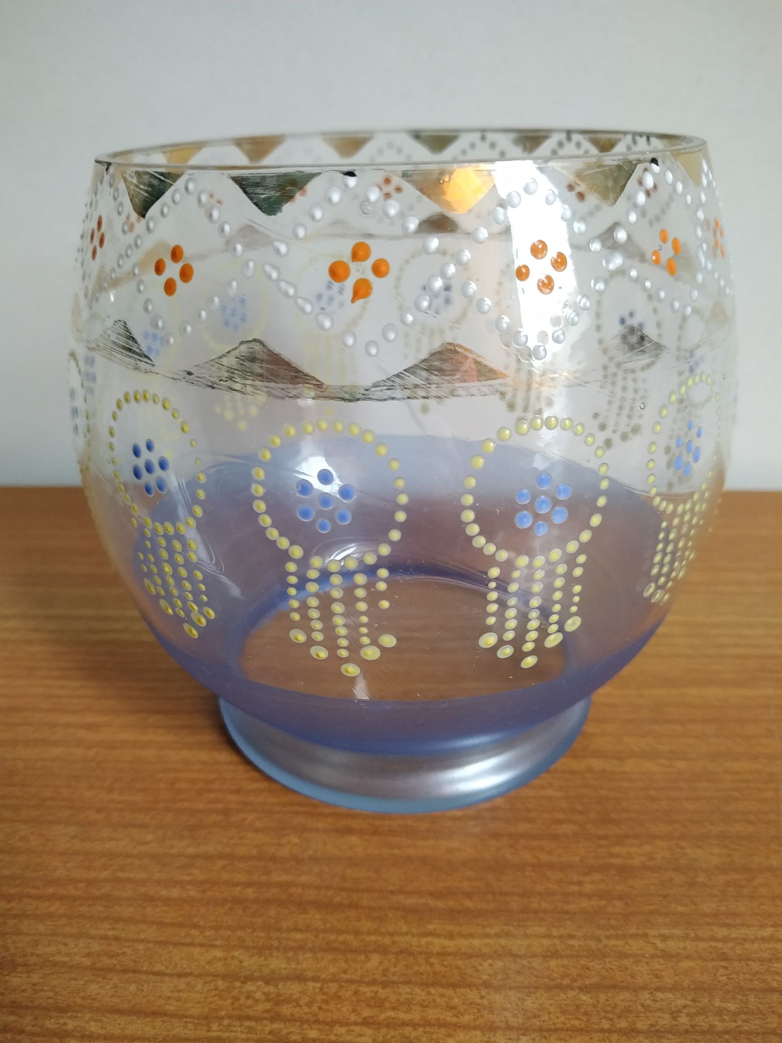 Enamelled glass ball vase decorated with beads and garlands