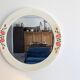 Vintage round mirror Syla model 6131 with rose decoration.