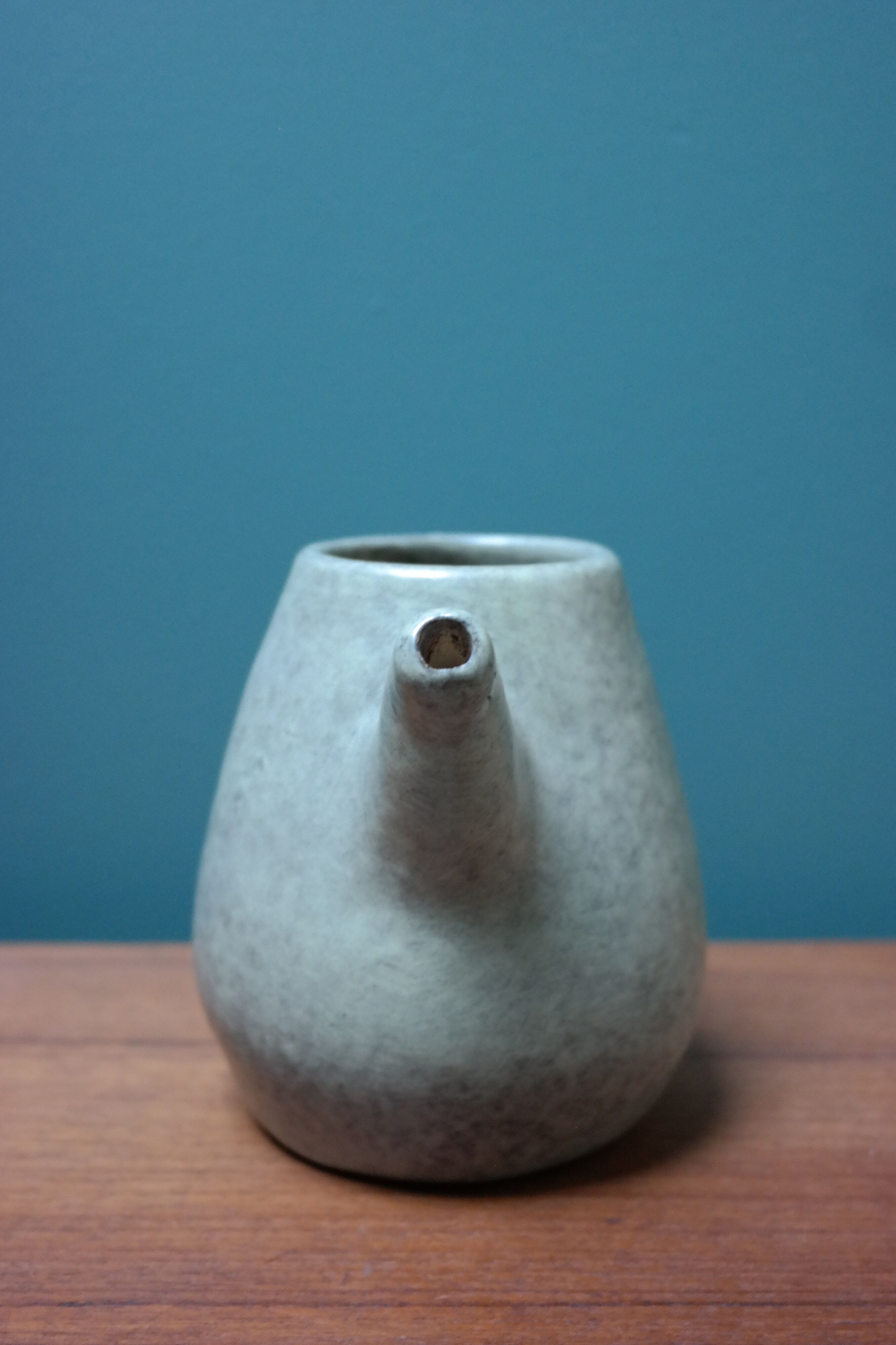 Small ceramic pitcher enamelled pale green, signed Max Idlas