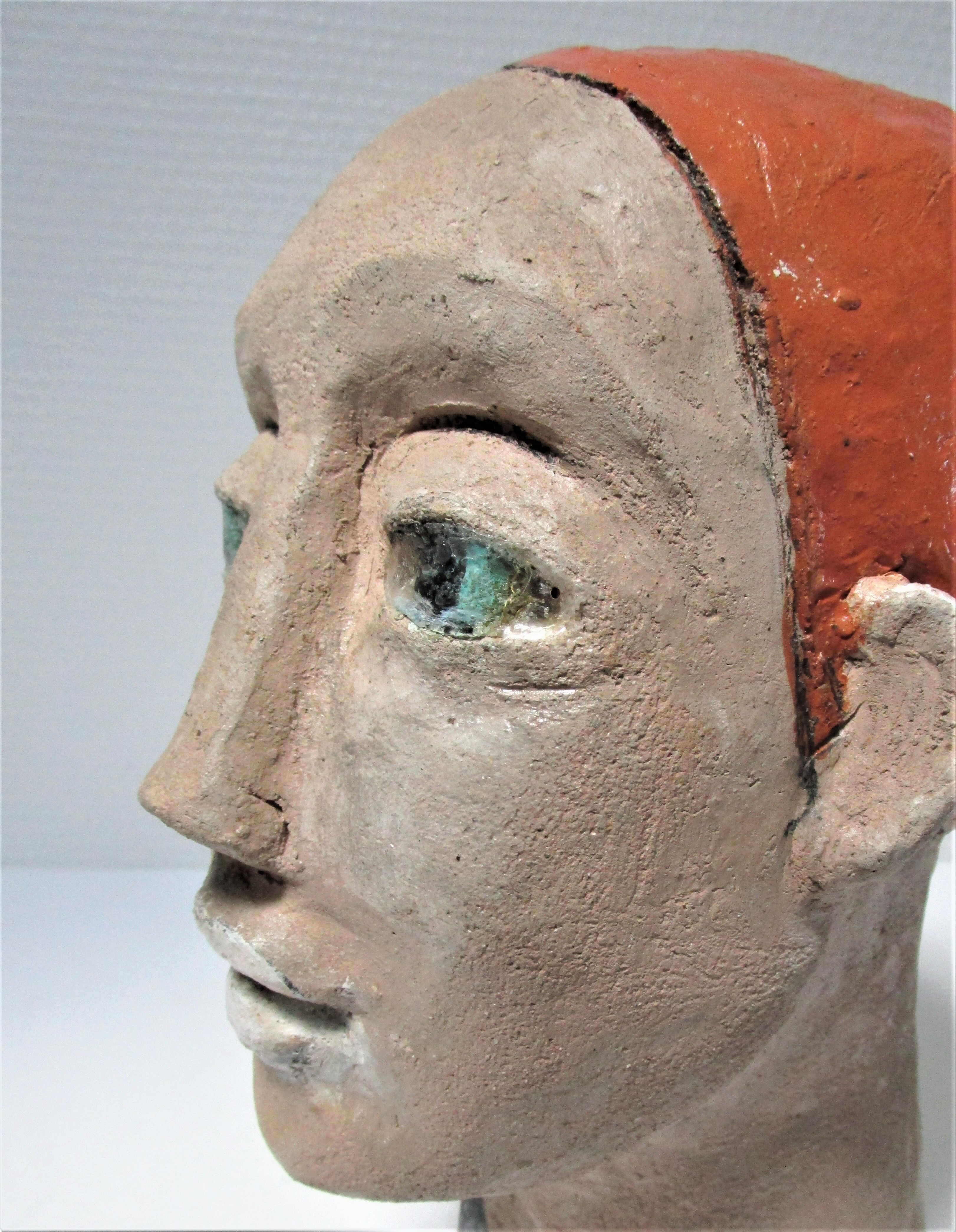 Redheaded boyish woman modeled in earth signed 60/70 years