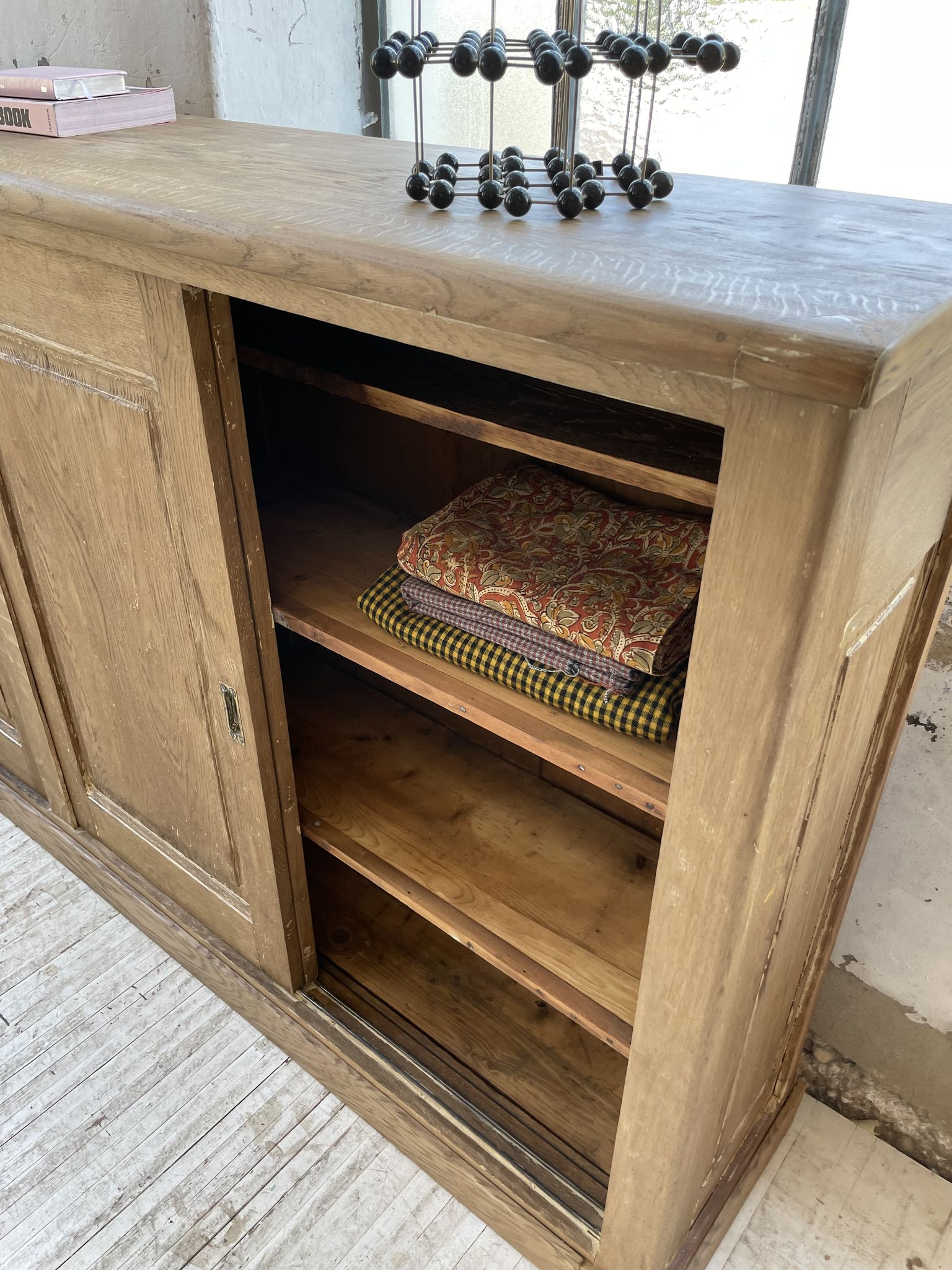 Large row of solid oak loom sliding doors