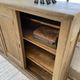 Large row of solid oak loom sliding doors