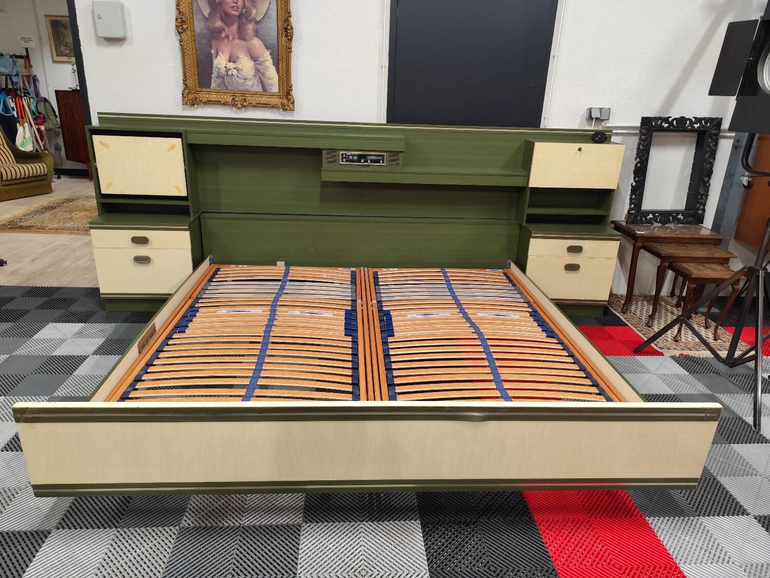 Vintage king-size bed with headboard furniture and built-in radio.
