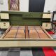 Vintage king-size bed with headboard furniture and built-in radio.